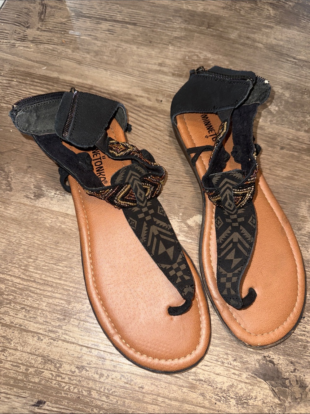 Minnetonka Black Strappy Beaded T-Style Sandals with Tan Footbed